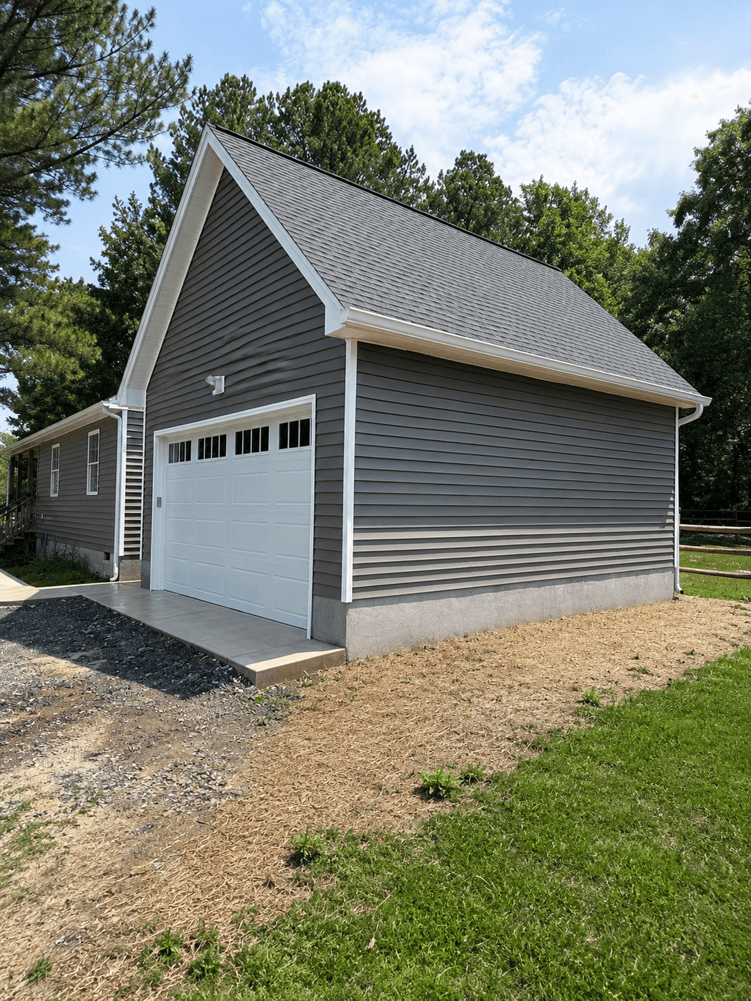 Sunny suburban garage with greenery