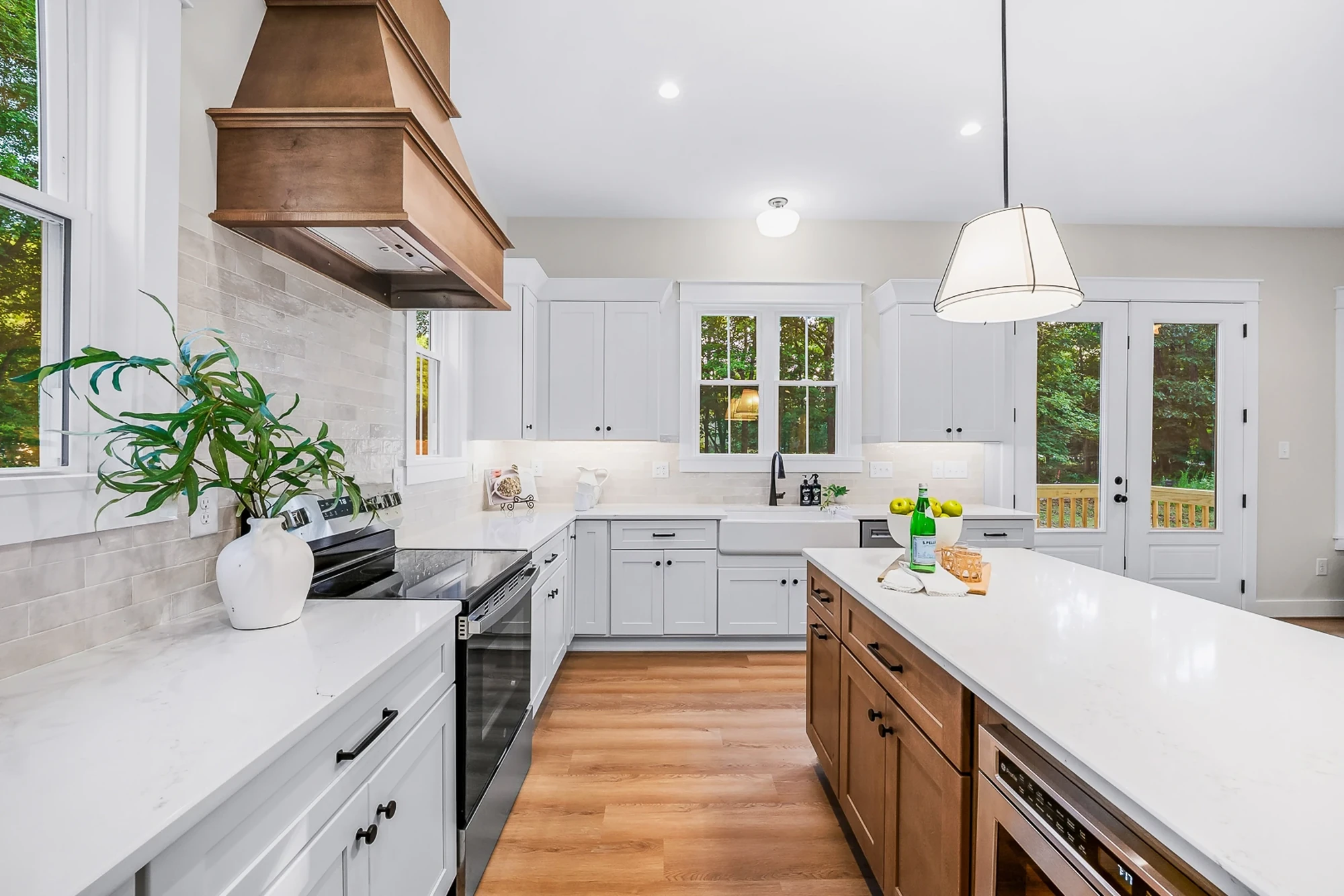 Custom kitchen — quartz island and pendant lighting