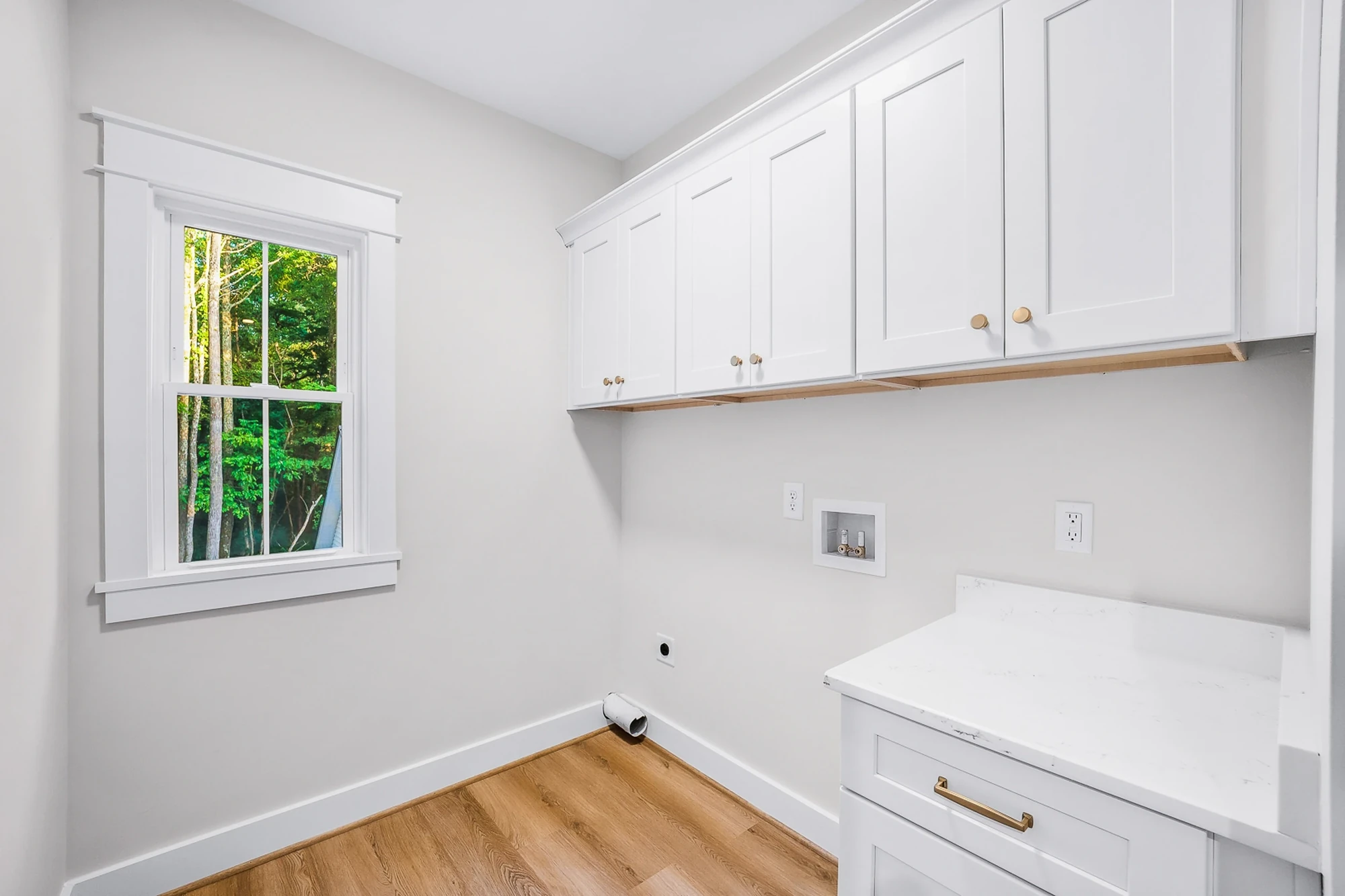 Laundry room with custom cabinetry