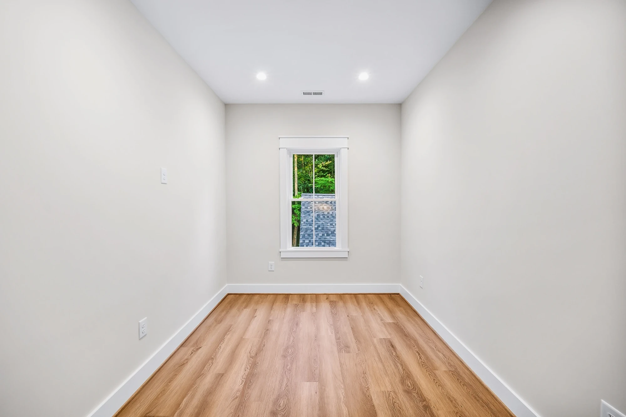 Bedroom with hardwood flooring