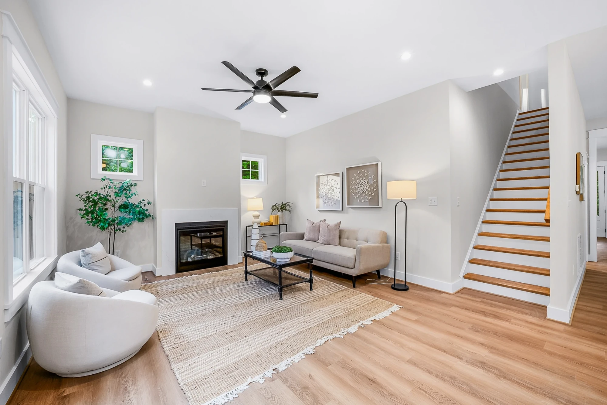 Living room with fireplace and staircase