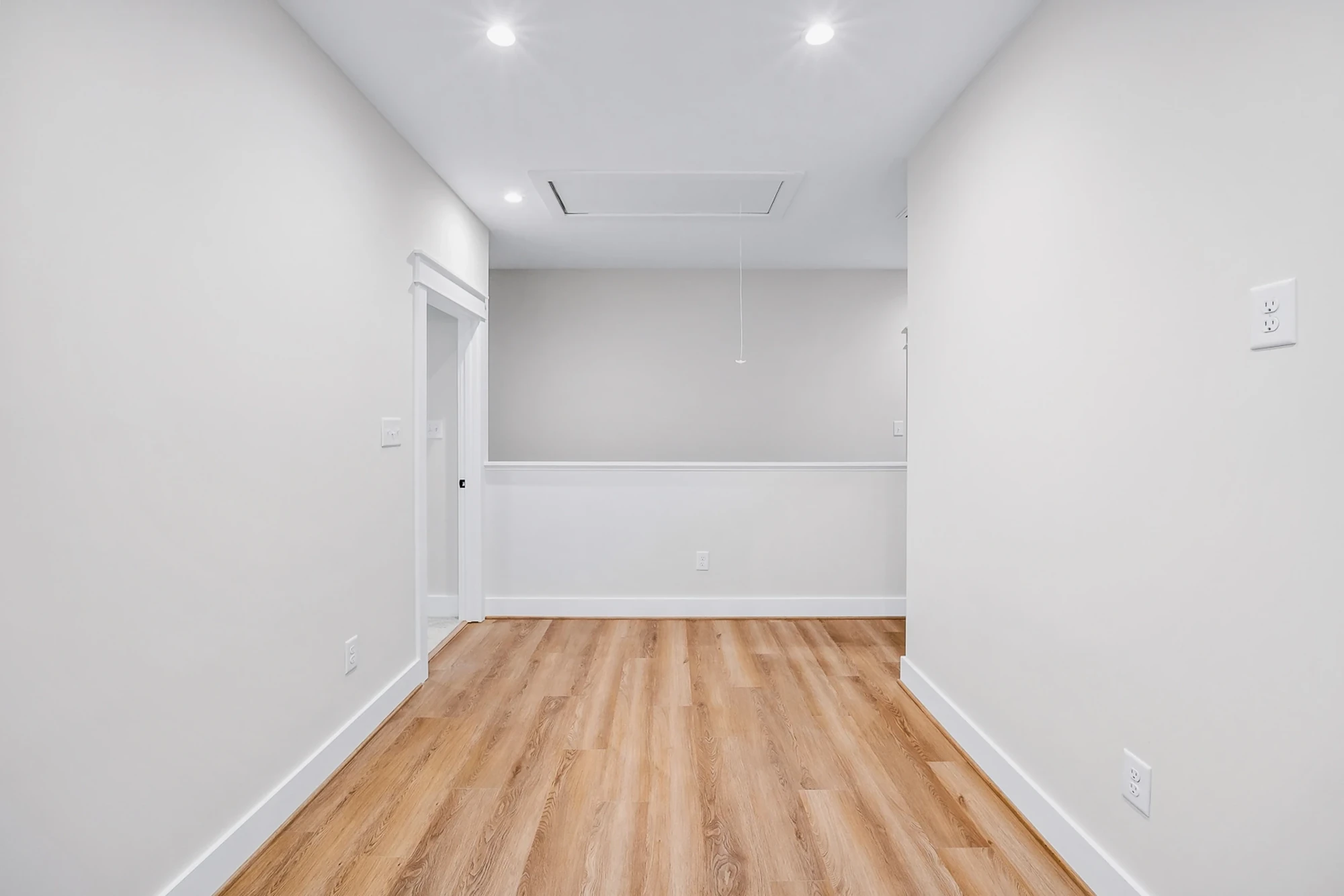 Hallway with hardwood flooring